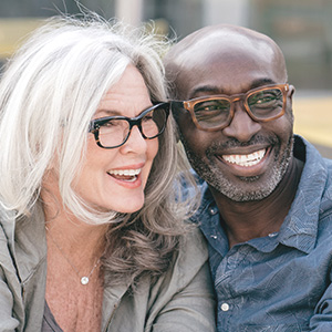mature mixed race couple wearing eye glasses